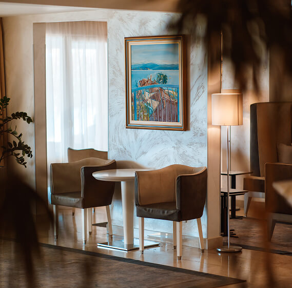 Interior of-hotel-with-two-chairs-and-painting